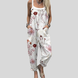 Weiße Latzhose mit roten Blüten