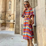 Cassandra - Vibrante Geometrische Kleid